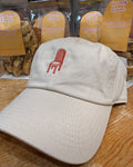 Sunday Tavola chair logo embroidered in burnt orange on an ivory baseball cap. 