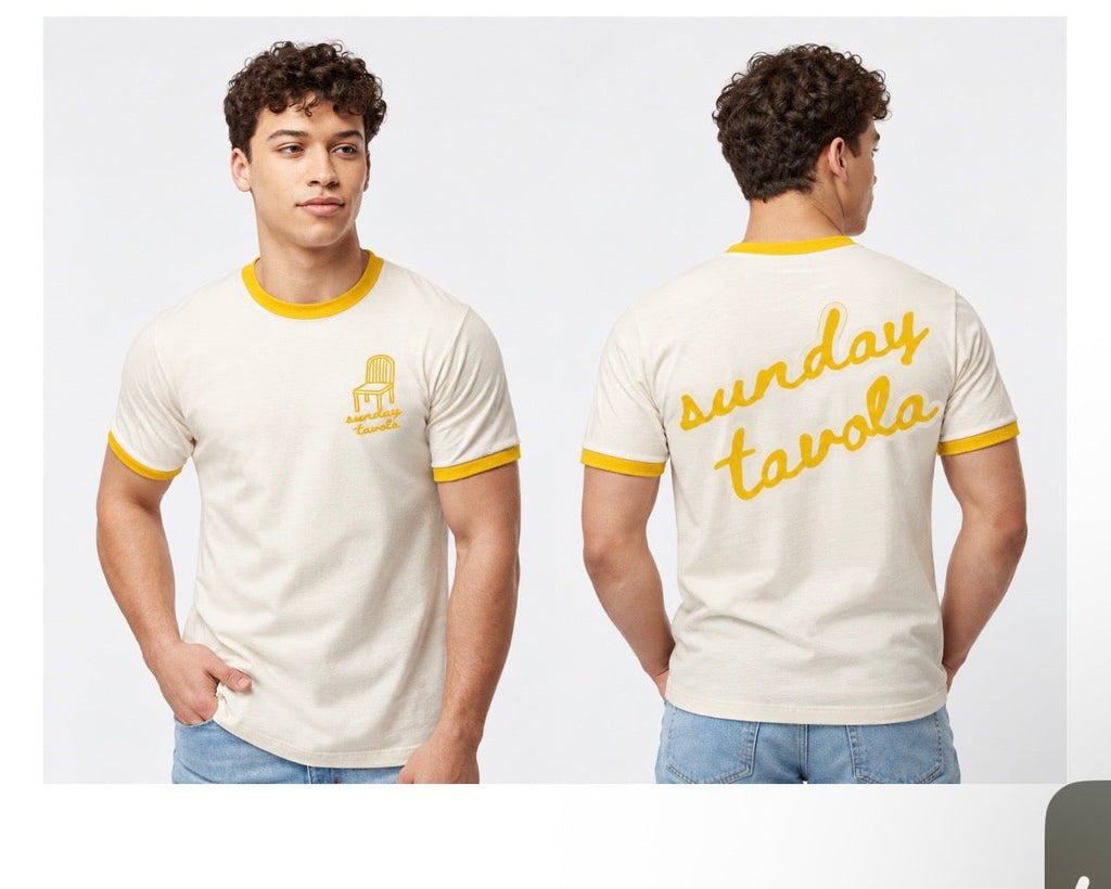 Sunday Tavola branded vintage white tee with mellow yellow piping around neck and sleeves. Chair logo on the front left in yellow and Sunday Tavola word logo across the back in yellow. 
