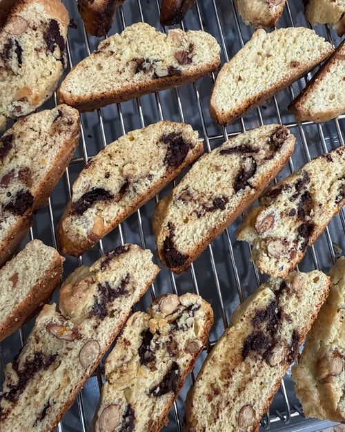 A selection of sunday tavola's cantucci spread on a cooling rack. 